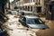 Flooding in an european country, with washed out street, destroyed furniture and cars floating in the water