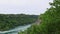 Flooding of the river - water gradually fills the bank of the canyon. Temporary covering of an area by water  flood or inundation