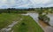 Flooding rivers flooding meadows a cloudy sky