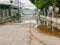 Flooding roadway as the clogged or ineffective street drainage system failed to release the water from the road