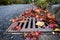 Flooding threat, fall leaves clogging a storm drain on a wet day, street and curb