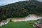 Flooding, water across river plains, farmland, and village, aerial view