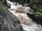 Flooding in waterfall in small river