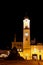 Floodlit clock tower in main square of Banska Bystrica Slovakia