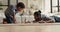 On floor african boy play wooden blocks with dad