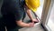 Floor laying worker with pencil make markings on laminate board