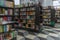 Floor racks with books in the store. Knowledge and education. Blurred