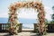 a floral archway set up for an outdoor wedding ceremony