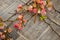 Floral arrangement and decoration.  Delicate spring flowers on a natural gray wood background