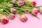 Floral banner pink background with place for text. Craft bag with tulips. Lots