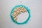 Floral beige half moon inside turquoise colored powder circle