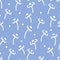 Floral boho seamless pattern with white daisies and polka dots on blue background in doodle style