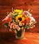 Floral bouquet with lily, sunflower, chrysanthemum, eustoma lisianthus astrantsiya, eucalyptus, shrub rose