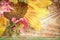 Floral card. Fresh beautiful yellow sunflower and pink wildflowers on brown textured wooden background with copyspace.
