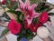 Floral display including Flashpoint pink and white Oriental Trumpet Lily closeup