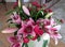 Floral display including Flashpoint pink and white Oriental Trumpet Lily closeup