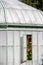 Floral displays viewed through an open window into the Geranium Gallery at the The Royal Greenhouses at Laeken, Brussels Belgium.