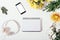 Floral flat lay composition with smart device