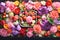 Floral Garden Bento Cake, colorful vegetables and fruits arranged as flowers Style on dark background. Close-up.