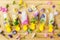 Floral Ice Pops and fresh summer flowers flat lay. Colorful wildflowers in melting ice hearts and popsicles on wooden background.