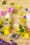 Floral Ice Pops and fresh summer flowers flat lay. Colorful wildflowers in melting ice hearts and popsicles on wooden background.