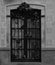 Floral iron fence with roses by the window