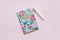 Floral journal/notepad on a pink background