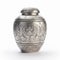 Floral Metal Urn In Silver With Scroll Pattern On White Background