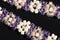 Floral pattern bracelet detail knitted from small beads.