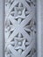 Floral pattern carved into a stone pillar