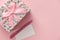 Floral pattern gift box on pink background