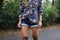 floral print shirt, paired with denim shorts and boots