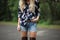 floral print shirt, paired with denim shorts and boots