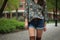 floral print shirt, paired with denim shorts and boots