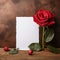 Floral simplicity Red rose with white paper on rustic tabletop