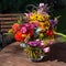 Floral summer bouquet, bunch of flowers, colorful flowers, dahlias, roses, tickseed, snapdragon flowering in one arrangement.