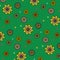 Floral vector pattern: multicolored flowers with many petals on a green background. Main colors: yellow, orange, blue.