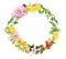 Floral wreath - blooming flowers, field grass. Watercolor round border