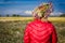 Floral wreath in head on blurred countryside background