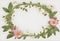 Floral Wreath with Pink Blooms on a White Background