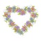 Floral wreath in the shape of a heart made of small decorative flowers in folk style