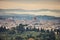 Florence aerial foggy morning cityscape. Panorama view from Fiesole hill, Italy