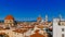 Florence Cathedral, Giotto`s Bell Tower, and San Lorenzo Basilica under blue sky, over houses of the historical center of Florenc