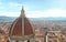 Florence city view with duomo dome and cityscape and mountains on horizon