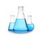 Florence and conical flasks with blue liquid on background. Laboratory glassware