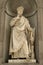 Florence, Italy - 23 April, 2018: Statue of Dante Allighieri on the Uffizi gallery