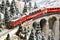 Florence, ITALY- December 2022: Model railway with Swiss Bernina express train on viaduct
