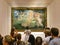 Florence, Italy - July 2022: Tourists taking photos in front of The Birth of Venus painting of Sandro Botticelli in Uffizi Gallery
