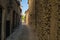 Florence, Italy. Narrow street between stone walls