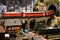 Florence, ITALY- November 2021: Railway model with Swiss Bernina Express Train on viaduct in mountains ambientation